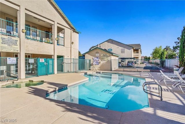 5171 Lindell Rd Unit 201, Las Vegas, NV 89118 - community pool featuring a patio and a residential view