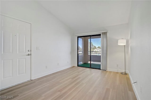 5171 Lindell Rd Unit 201, Las Vegas, NV 89118 - empty room with baseboards, light wood finished floors, and lofted ceiling