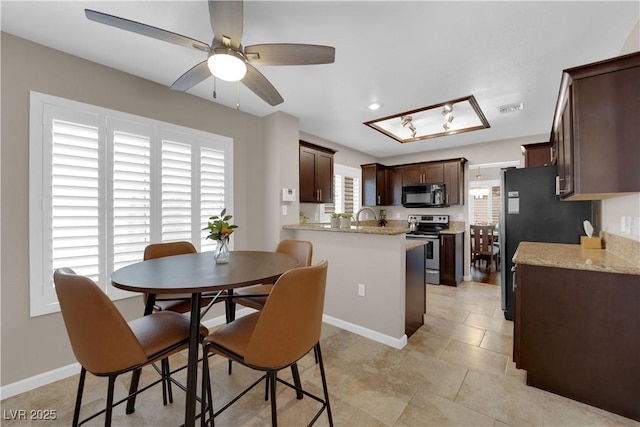 2701 Glencliff Dr, Las Vegas, NV 89134 - dining room with ceiling fan, baseboards, and light tile patterned floors