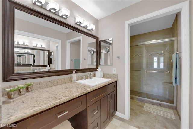 2701 Glencliff Dr, Las Vegas, NV 89134 - bathroom featuring a stall shower, vanity, tile patterned flooring, and baseboards