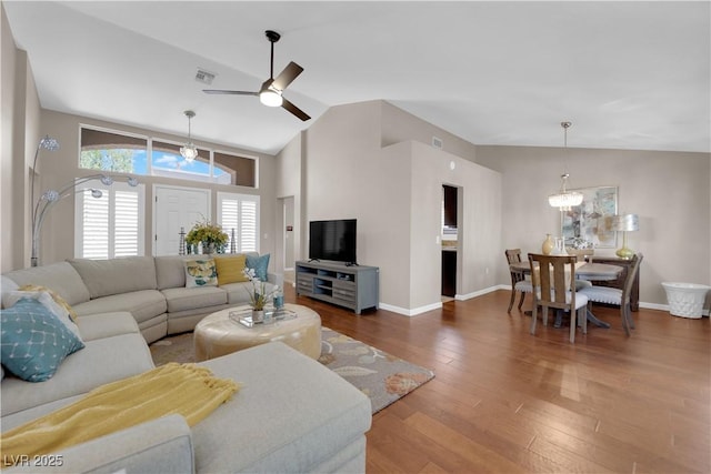 2701 Glencliff Dr, Las Vegas, NV 89134 - living room featuring a ceiling fan, wood finished floors, baseboards, and high vaulted ceiling