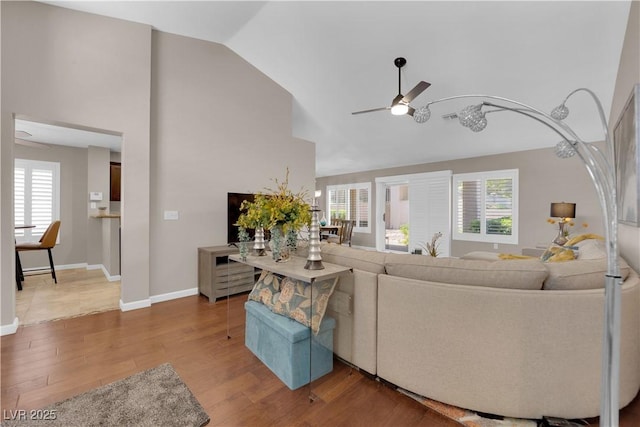 2701 Glencliff Dr, Las Vegas, NV 89134 - living area featuring ceiling fan, wood finished floors, baseboards, and high vaulted ceiling