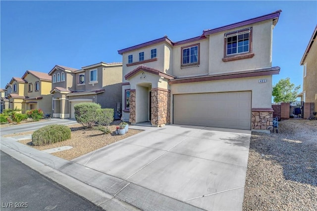 405 Prairie Moon Ave, North Las Vegas, NV 89084 - view of front of property with stone siding, an attached garage, stucco siding, concrete driveway, and a residential view