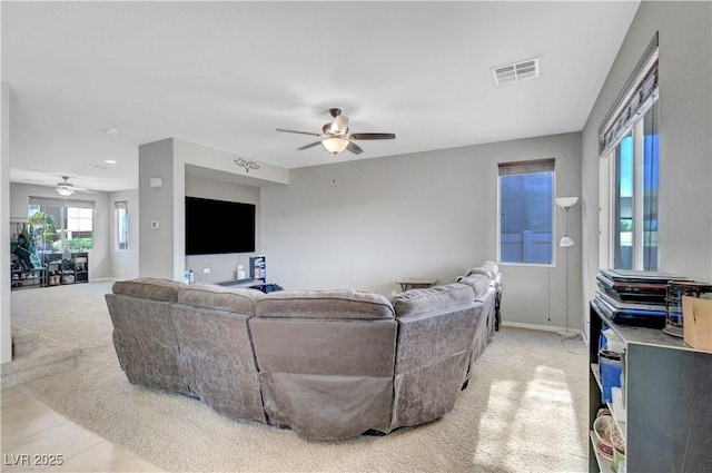 405 Prairie Moon Ave, North Las Vegas, NV 89084 - living room featuring ceiling fan, light colored carpet, and baseboards