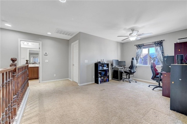 405 Prairie Moon Ave, North Las Vegas, NV 89084 - home office with light colored carpet, a ceiling fan, and baseboards