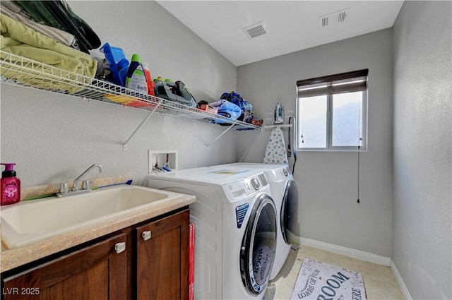 405 Prairie Moon Ave, North Las Vegas, NV 89084 - laundry area with washing machine and clothes dryer and cabinet space