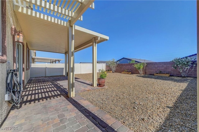 405 Prairie Moon Ave, North Las Vegas, NV 89084 - fenced backyard with a patio area and a pergola