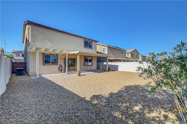 405 Prairie Moon Ave, North Las Vegas, NV 89084 - rear view of property featuring stucco siding, a patio, a fenced backyard, and a residential view