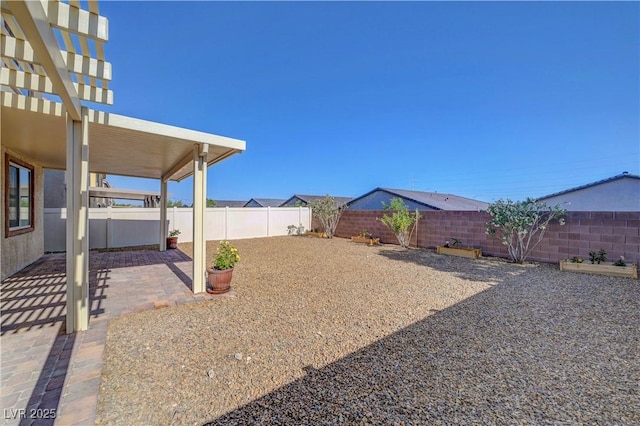 405 Prairie Moon Ave, North Las Vegas, NV 89084 - fenced backyard with a patio area and a pergola