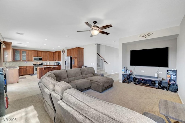 405 Prairie Moon Ave, North Las Vegas, NV 89084 - living area with light colored carpet, stairway, a ceiling fan, and recessed lighting