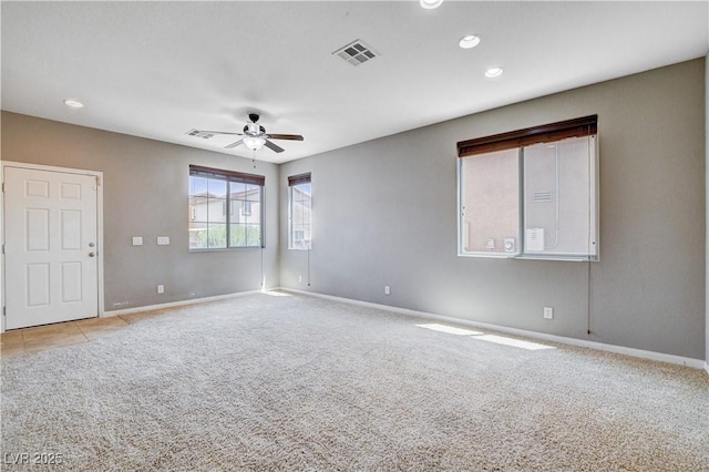 405 Prairie Moon Ave, North Las Vegas, NV 89084 - spare room featuring light carpet, a ceiling fan, and recessed lighting