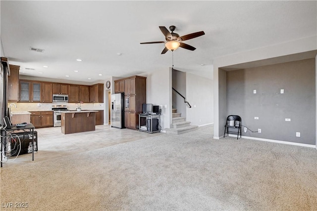 405 Prairie Moon Ave, North Las Vegas, NV 89084 - living room featuring stairs, a ceiling fan, recessed lighting, and light carpet