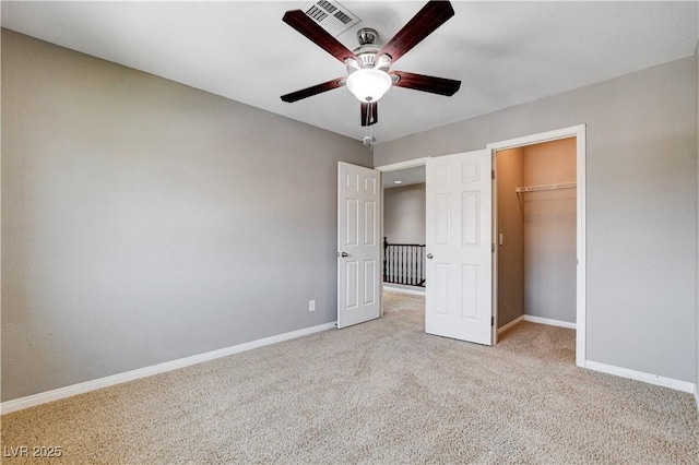 405 Prairie Moon Ave, North Las Vegas, NV 89084 - unfurnished bedroom with carpet floors, ceiling fan, a closet, and a walk in closet
