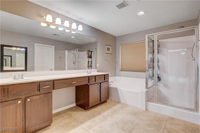 405 Prairie Moon Ave, North Las Vegas, NV 89084 - bathroom with a shower stall, a garden tub, double vanity, and tile patterned floors