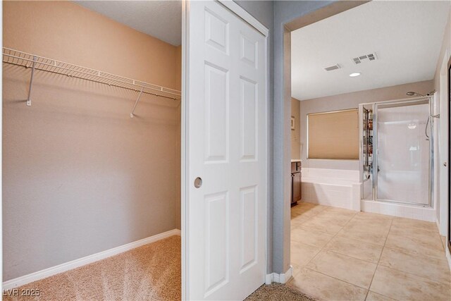 405 Prairie Moon Ave, North Las Vegas, NV 89084 - bathroom with a stall shower, a bath, and a spacious closet