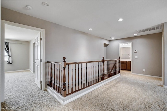 405 Prairie Moon Ave, North Las Vegas, NV 89084 - hall with light colored carpet, an upstairs landing, and recessed lighting