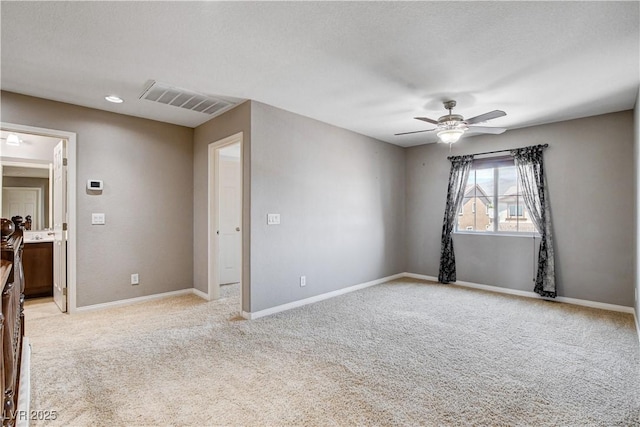 405 Prairie Moon Ave, North Las Vegas, NV 89084 - empty room with light carpet and a ceiling fan
