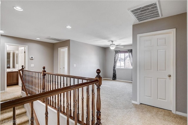 405 Prairie Moon Ave, North Las Vegas, NV 89084 - corridor with light colored carpet, an upstairs landing, and recessed lighting