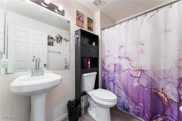 3420 Winterhaven St Unit 202, Las Vegas, NV 89108 - bathroom with toilet, wood finished floors, and a sink
