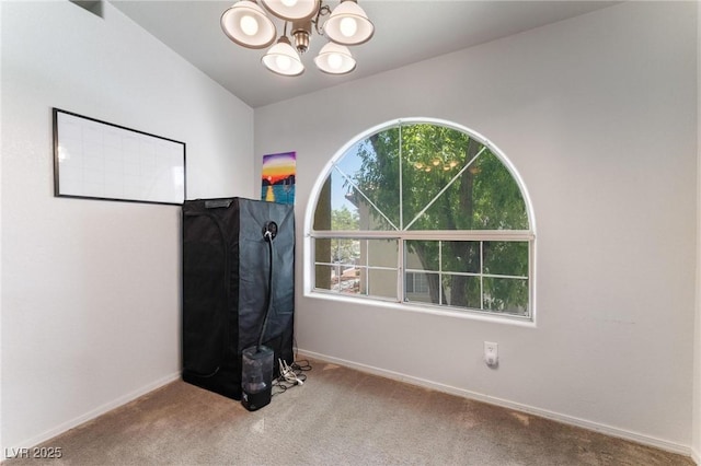 3420 Winterhaven St Unit 202, Las Vegas, NV 89108 - unfurnished bedroom featuring a chandelier, carpet, and baseboards