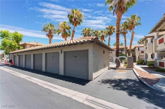 3420 Winterhaven St Unit 202, Las Vegas, NV 89108 - garage featuring a residential view and a gate