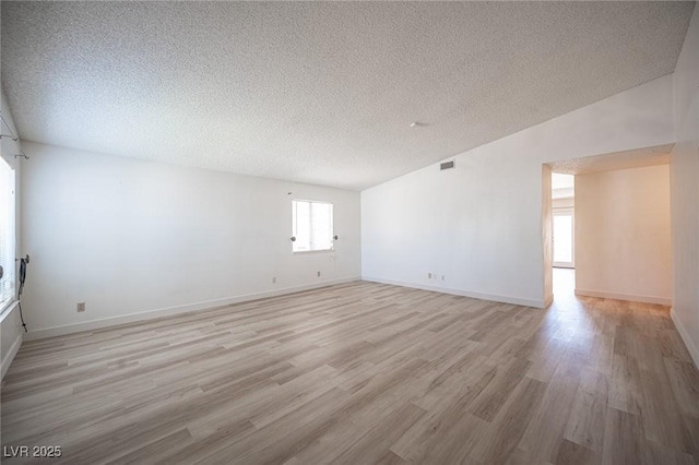 4409 Rosebank Cir, Las Vegas, NV 89108 - spare room with a textured ceiling, light wood finished floors, and baseboards