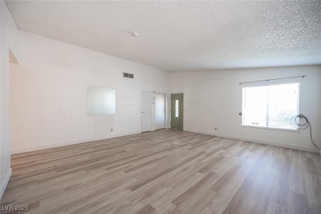 4409 Rosebank Cir, Las Vegas, NV 89108 - empty room featuring a textured ceiling, light wood-style flooring, and baseboards