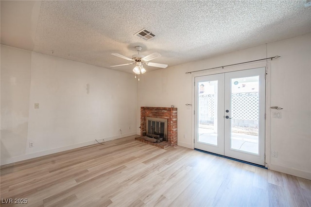 4409 Rosebank Cir, Las Vegas, NV 89108 - unfurnished living room featuring french doors, a textured ceiling, light wood finished floors, a ceiling fan, and baseboards