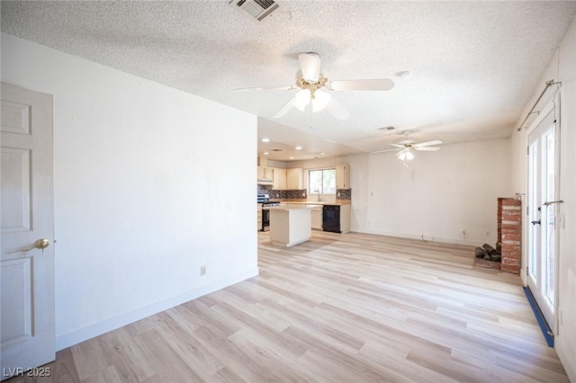 4409 Rosebank Cir, Las Vegas, NV 89108 - unfurnished living room with light wood-style floors, a textured ceiling, a ceiling fan, baseboards, and recessed lighting