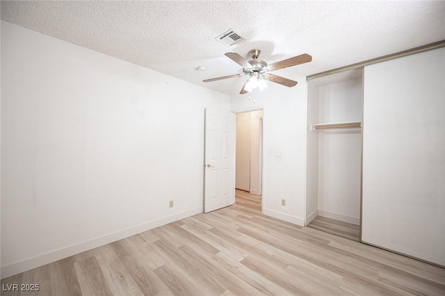 4409 Rosebank Cir, Las Vegas, NV 89108 - unfurnished bedroom with light wood-type flooring, a textured ceiling, a closet, ceiling fan, and baseboards