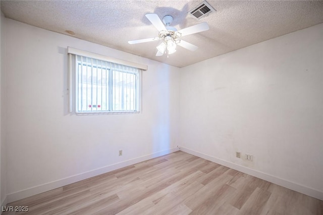 4409 Rosebank Cir, Las Vegas, NV 89108 - spare room featuring light wood-style floors, a textured ceiling, ceiling fan, and baseboards