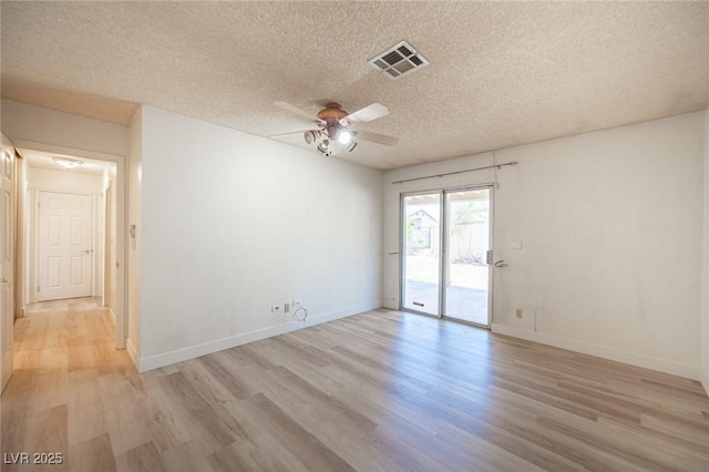 4409 Rosebank Cir, Las Vegas, NV 89108 - unfurnished room with a textured ceiling, light wood finished floors, ceiling fan, and baseboards