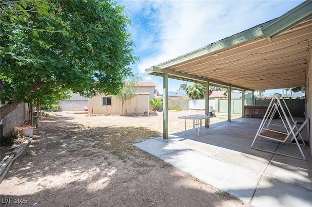 4409 Rosebank Cir, Las Vegas, NV 89108 - fenced backyard with a patio and a hot tub