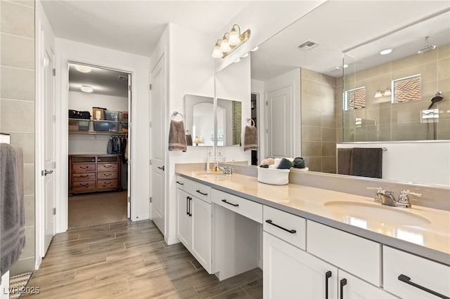 977 Majestic Vw, Mesquite, NV 89034 - full bath featuring double vanity, a tile shower, wood finished floors, and a walk in closet