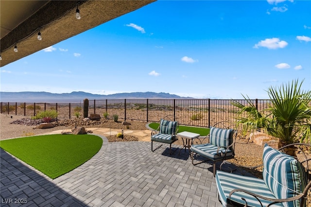 977 Majestic Vw, Mesquite, NV 89034 - fenced backyard with a mountain view and a patio area