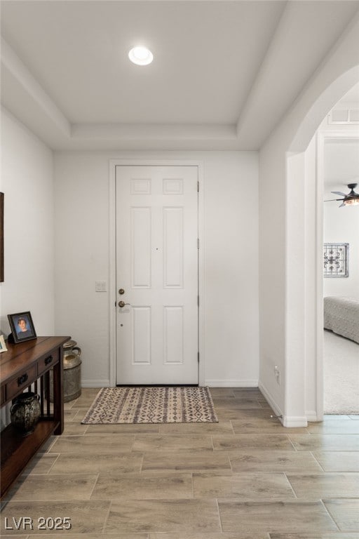 977 Majestic Vw, Mesquite, NV 89034 - entrance foyer featuring arched walkways, a tray ceiling, wood tiled floors, and recessed lighting