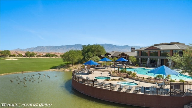 977 Majestic Vw, Mesquite, NV 89034 - surrounding community with a hot tub, a pool, a patio area, a water and mountain view, and golf course view