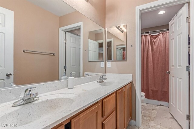6954 Jacksboro Ct, North Las Vegas, NV 89084 - full bathroom featuring toilet, double vanity, and curtained shower