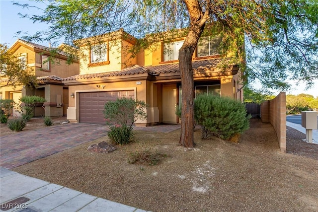 6954 Jacksboro Ct, North Las Vegas, NV 89084 - view of front of home featuring stucco siding, an attached garage, decorative driveway, and a tiled roof