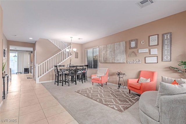 6954 Jacksboro Ct, North Las Vegas, NV 89084 - tiled living area featuring stairs, a chandelier, healthy amount of natural light, carpet floors, and recessed lighting