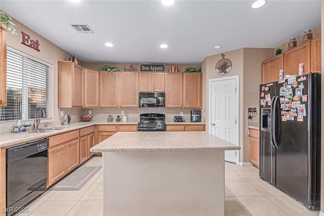 6954 Jacksboro Ct, North Las Vegas, NV 89084 - kitchen featuring black appliances, a sink, light tile patterned floors, light brown cabinets, and recessed lighting