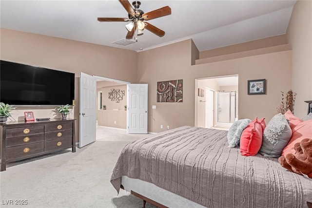 6954 Jacksboro Ct, North Las Vegas, NV 89084 - carpeted bedroom featuring lofted ceiling, ceiling fan, baseboards, and connected bathroom