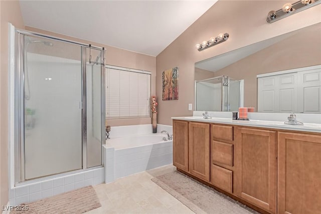 6954 Jacksboro Ct, North Las Vegas, NV 89084 - bathroom with a stall shower, a bath, double vanity, vaulted ceiling, and tile patterned flooring
