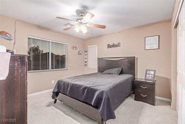 6954 Jacksboro Ct, North Las Vegas, NV 89084 - bedroom with light colored carpet, baseboards, and ceiling fan