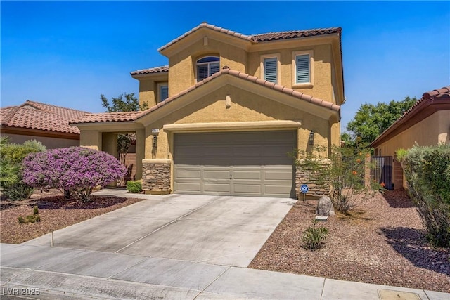 6440 Bristlebird St, North Las Vegas, NV 89084 - mediterranean / spanish-style home featuring a tiled roof, concrete driveway, and stucco siding