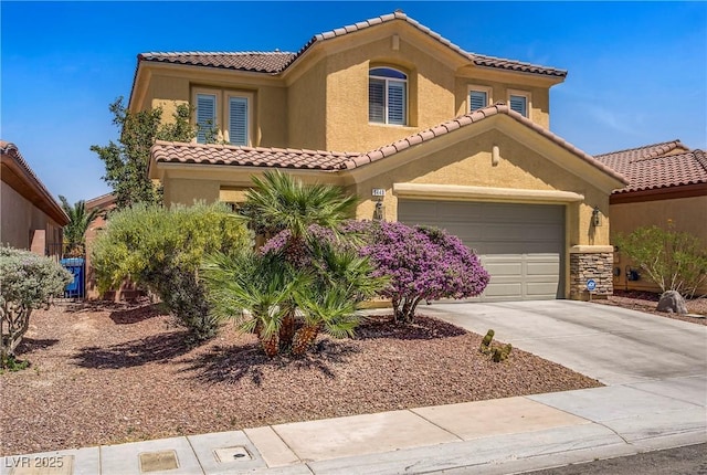6440 Bristlebird St, North Las Vegas, NV 89084 - mediterranean / spanish house featuring a tile roof, stucco siding, concrete driveway, and a garage