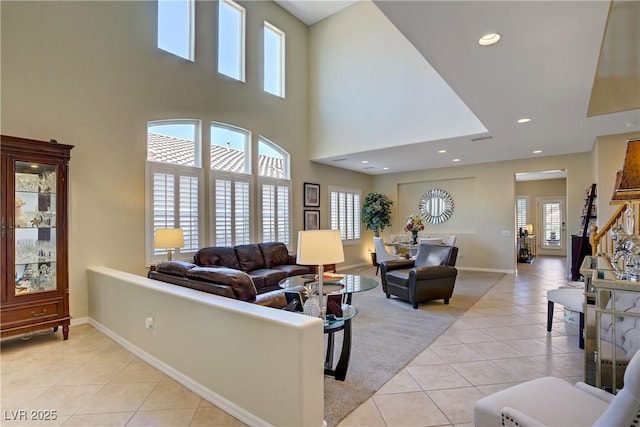 6440 Bristlebird St, North Las Vegas, NV 89084 - living area with light tile patterned flooring, baseboards, a high ceiling, and recessed lighting