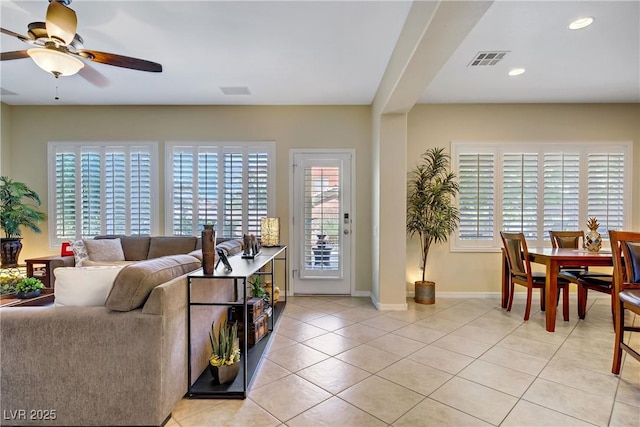 6440 Bristlebird St, North Las Vegas, NV 89084 - living room with light tile patterned floors, ceiling fan, baseboards, and recessed lighting