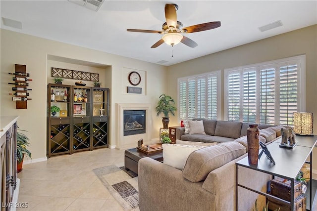 6440 Bristlebird St, North Las Vegas, NV 89084 - living room featuring plenty of natural light, a ceiling fan, baseboards, and light tile patterned flooring