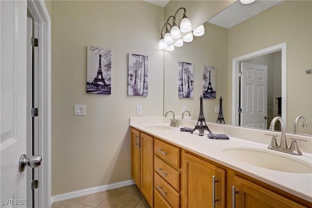 6440 Bristlebird St, North Las Vegas, NV 89084 - bathroom featuring double vanity, tile patterned flooring, and baseboards
